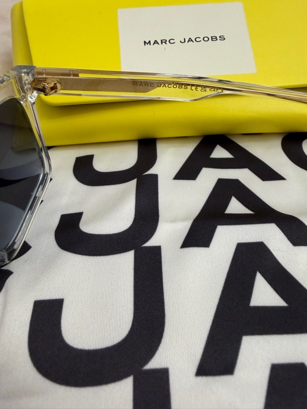 Marc Jacobs Clear Frame Sunglasses with Dark Gray Lenses and Yellow Case - Picture 3 of 4